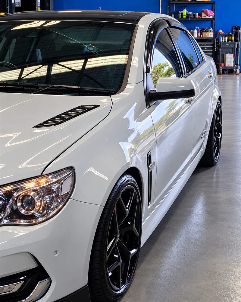 White Holden VF SS front three-quarter view in the workshop