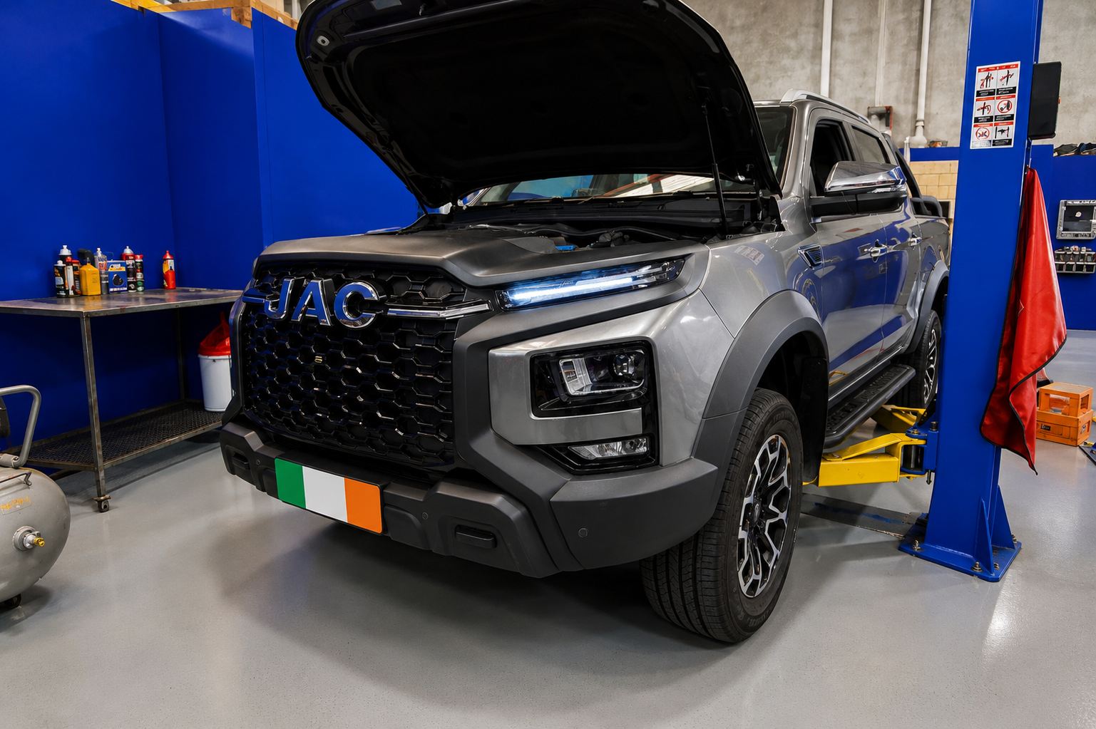 Grey JAC T9 ute with the bonnet up in the workshop