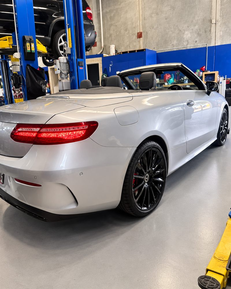 Silver Mercedes-Benz E-Class cabriolet rear three-quarter view