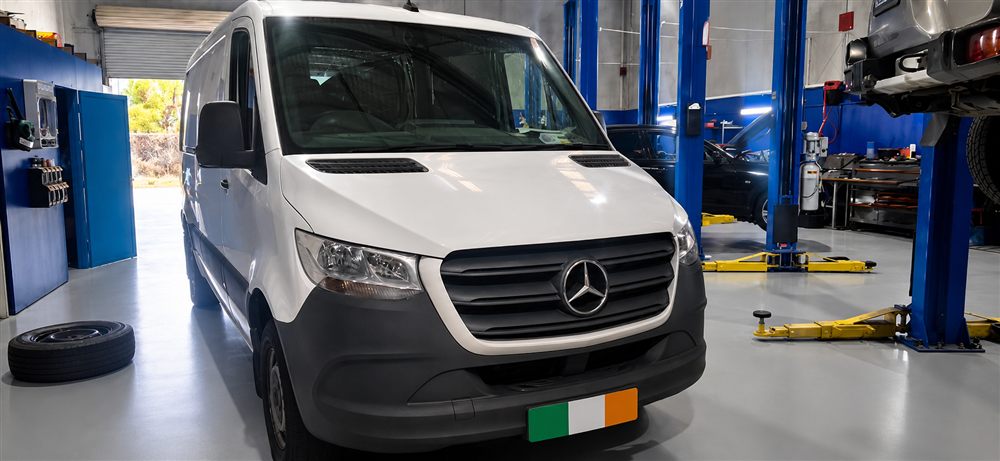 White Mercedes-Benz Sprinter van front view in the workshop