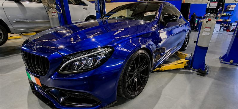 Blue Mercedes-AMG C63 coupe front three-quarter view