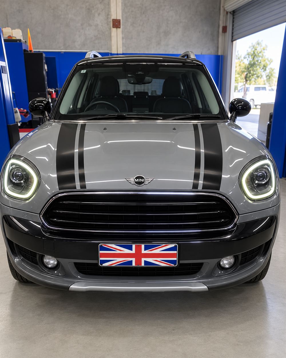 Grey MINI Countryman front view on the workshop floor