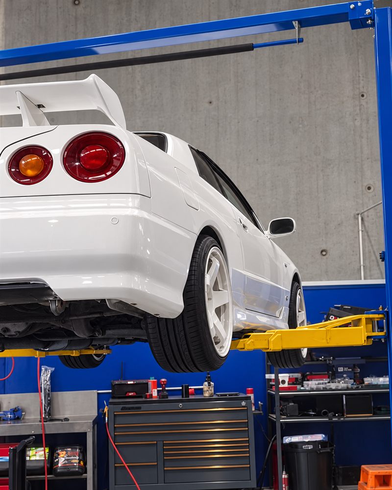Rear of a Nissan Skyline R34 lifted on the hoist