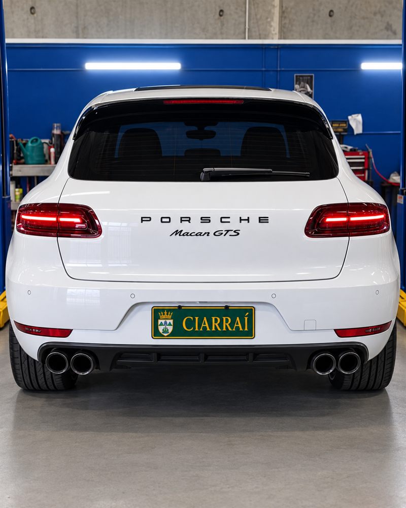 Rear of a white Porsche Macan GTS with quad exhausts