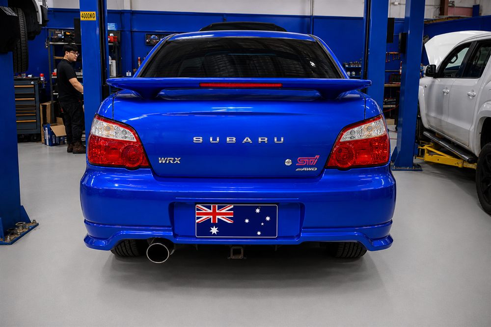 Rear of a blue Subaru Impreza WRX STI with its wing