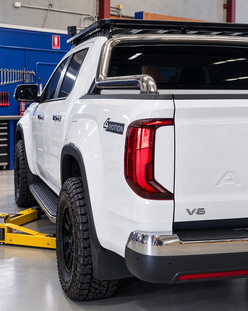 Rear three-quarter view of a white VW Amarok V6
