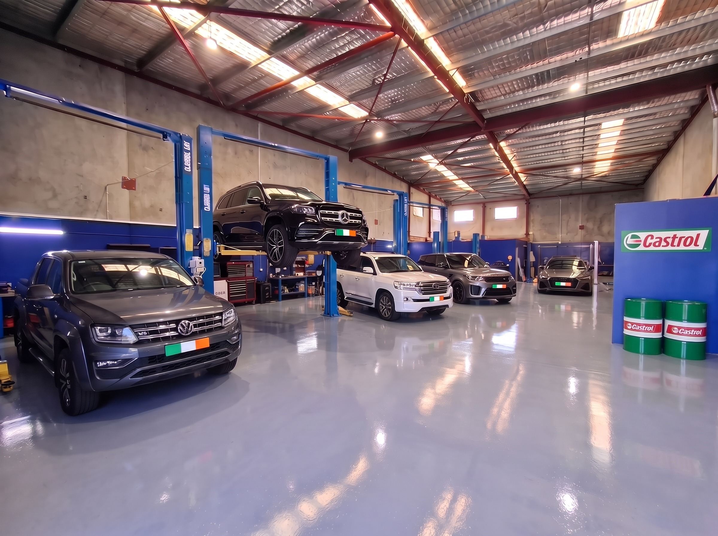 VW Amarok, Mercedes GLS on a hoist, LandCruiser, Range Rover Sport and Audi in the workshop
