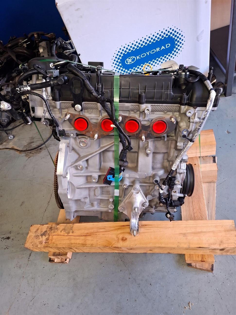 Engine on a pallet showing the front of the block where the timing components sit