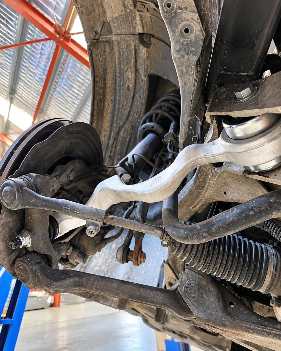 Front suspension control arm and steering rack seen from underneath