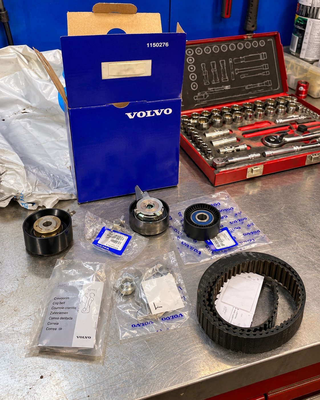 Genuine Volvo timing belt kit laid out on the bench