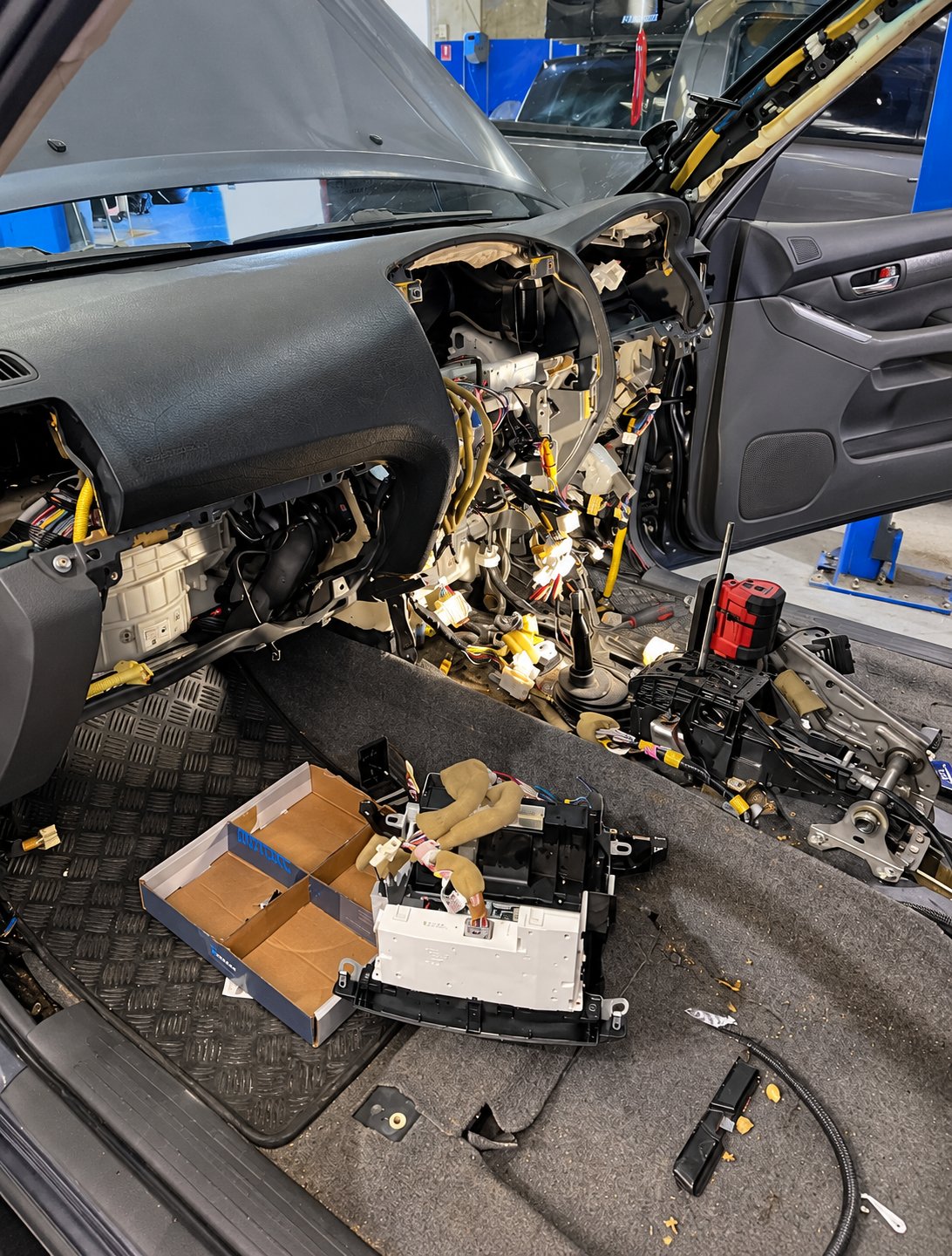 Dash removed with the heater box sitting in the footwell