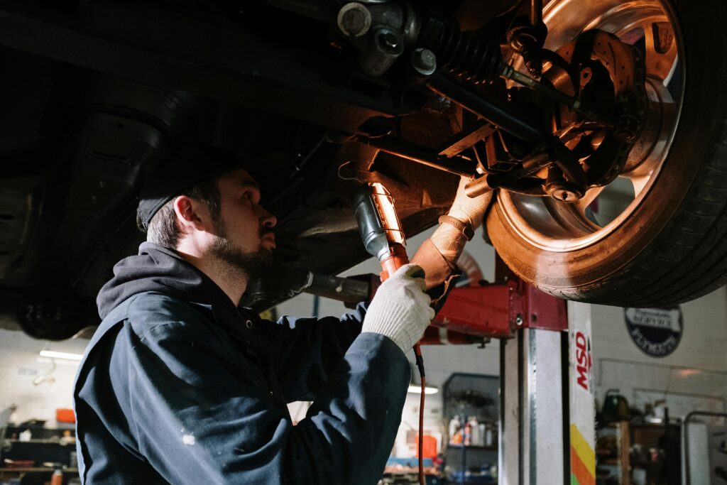 a man inspecting the tyre condition for mechanics malaga